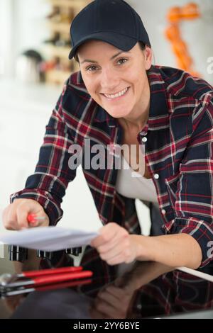 woman installing a new hob in modern kitchen Stock Photo