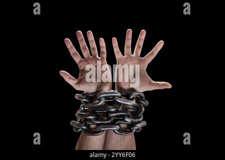Two hands in chains isolated on black background with clipping path Stock Photo