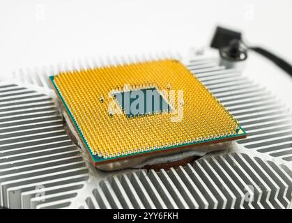 Pin side of a CPU processor mounted on a cooler Stock Photo