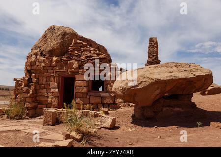 An old abandoned rock masonry dwelling at the feet of Vermilion Cliffs National Monument along US 89A. Near Page Arizona. Stock Photo