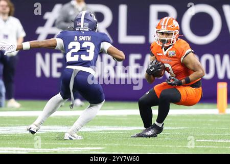 New Orleans, United States. 19th Dec, 2024. Sam Houston State Bearkats wide receiver Simeon Evans (3) tries to make a move against Georgia Southern Eagles defensive back Dorrian Smith (23) during the first half of the R L Carriers New Orleans Bowl at Caesars Superdome on Thursday, December 19, 2024 in New Orleans, Louisiana. (Photo by Peter G. Forest/SipaUSA) Credit: Sipa USA/Alamy Live News Stock Photo