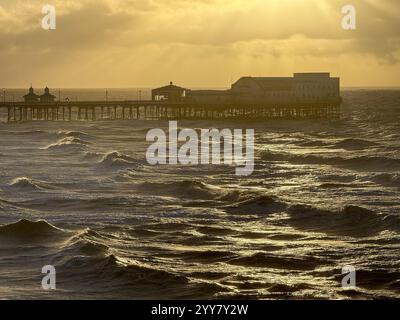 UK Weather: windy in Blackpool. North pier in late afternoon at high tide. Stock Photo