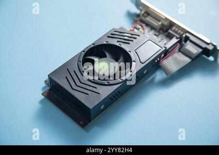 Computer graphics card on the blue background. Stock Photo