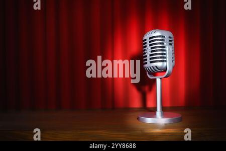 Vintage metal microphone with stand  on a stage with wooden platform and red curtains illuminated with a spotlight. Stock Photo