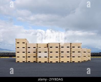 Stack of plastic fish tubs on an open lot Stock Photo