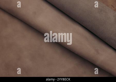 Close-up of brown leather rolls for artisan crafting Stock Photo