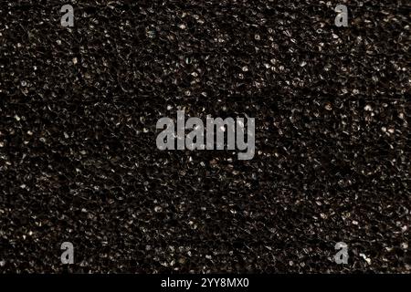 black foam for insulation and packaging of goods, black foam material for construction and storage Stock Photo