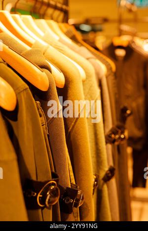 Stylish seasonal clothing on male and female mannequins in a shopping ...