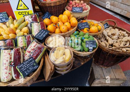 Fresh fruit and vegetables on display in baskets. Borough Market, London, UK Stock Photo