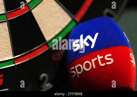 A close up of a Sky Sports mic pop filter next to a dartboard during day six of the Paddy Power World Darts Championship at Alexandra Palace, London. Picture date: Friday December 20, 2024. Stock Photo