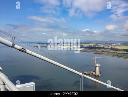 View from top of Forth Road Bridge to Queensferry Crossing bridge tower  being built, Scotland, UK Stock Photo