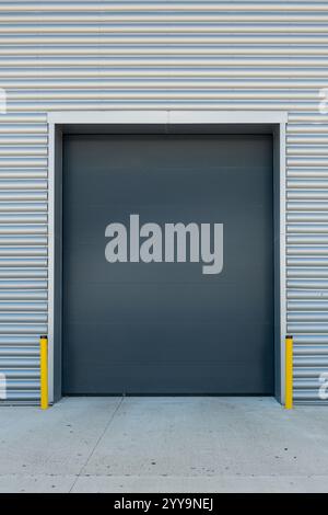 Exterior of an industrial unit with metal roller shutter doors Stock Photo