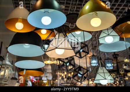 Cozy modern lights for sale! Warm glow, vintage bulbs, hanging LEDs, fairy vibes, dreamy showroom shots, perfect for decor, interiors, ambiance, light Stock Photo