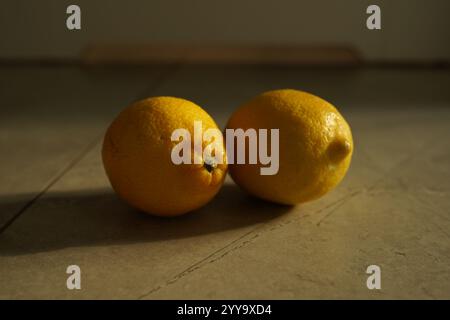 two lemons path isolated on grey background Stock Photo
