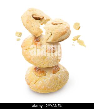 Tasty cookies with cashew nuts in air on white background Stock Photo