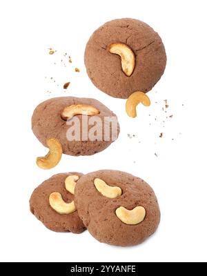 Tasty cookies with cashew nuts in air on white background Stock Photo