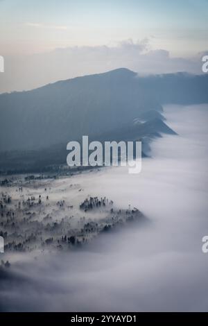 Low Clouds rolling in over mountain ridge Stock Photo