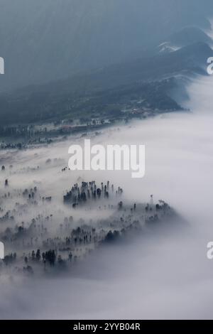 Low Clouds rolling in over mountain ridge Stock Photo