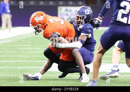 New Orleans, United States. 19th Dec, 2024. Georgia Southern Eagles defensive back Tracy Hill Jr. (12) tackles Sam Houston State Bearkats wide receiver Simeon Evans (3) during the second half of the R L Carriers New Orleans Bowl at Caesars Superdome on Thursday, December 19, 2024 in New Orleans, Louisiana. (Photo by Peter G. Forest/SipaUSA) Credit: Sipa USA/Alamy Live News Stock Photo