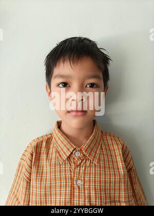 Portrait of Asian school boy wearing uniform Stock Photo