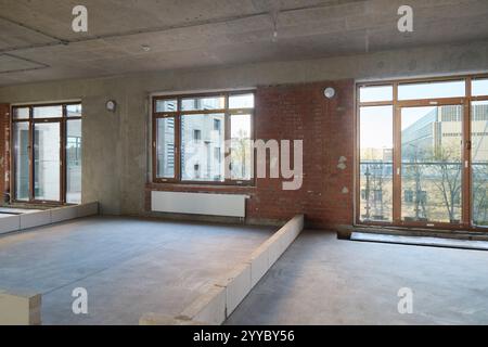Explore the Modern Industrial Interior featuring Expansive Large Windows that Light Up the Space Stock Photo
