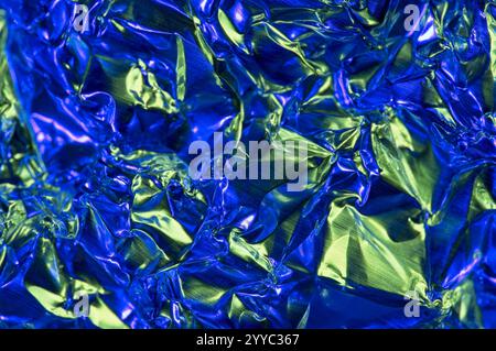 Abstract background of shiny metallic sheet with blue and green light reflections Stock Photo