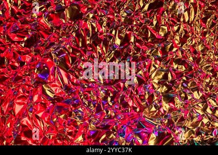 Abstract background of colored light on wrinkled aluminum foil Stock Photo
