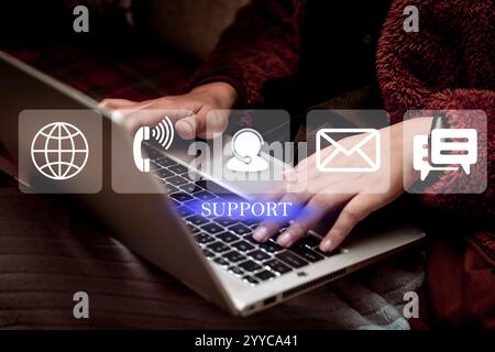 Technical Support Center Customer Service Internet Business Technology Concept. Closeup of hands typing on laptop. Work From Home Stock Photo
