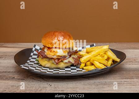 Burger popularity is due, in large part, to the ease of preparation and the simplicity when it comes to eating it, without the need for special plates Stock Photo