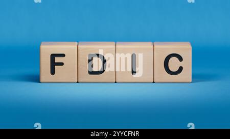 fdic word written on wooden cubes with copy space.close up of wooden elements,Business Concept.3D rendering on blue background. Stock Photo