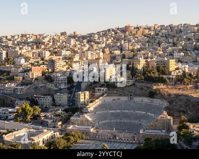 Panoramic views of Amman with the Roman Theater in the foreground during sunset Stock Photo