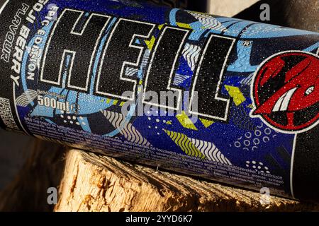 "A close-up of a limited edition energy drink can featuring a goji berry flavor and dynamic graphic elements. The metal can, covered in water droplets Stock Photo
