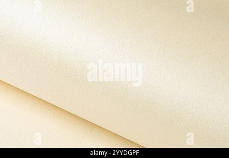 Beige paper texture with a luminous, pearlescent finish and smooth, fibrous surface. The light, neutral tones and subtle satin gradient exude a natura Stock Photo