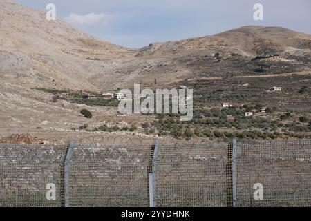 Majdal Shams, Israel. 20th Dec, 2024. A view of the Israeli fence on the border with Syria, adjacent to the Druze village of Majdal Shams, located in the Israeli controlled Golan Heights. Credit: Nir Alon/Alamy Live News Stock Photo