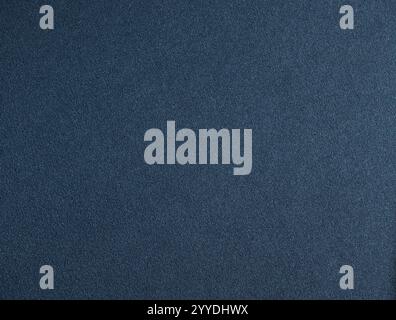 Dark blue paper texture with deep midnight blue, subtle grainy finish. The minimalist design creates a rich, elegant backdrop, perfect for luxury stat Stock Photo