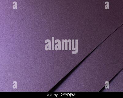 Deep purple paper texture with a pearlescent metallic finish, featuring sleek lines and a glowing gradient. The rich amethyst and lavender tones shimm Stock Photo