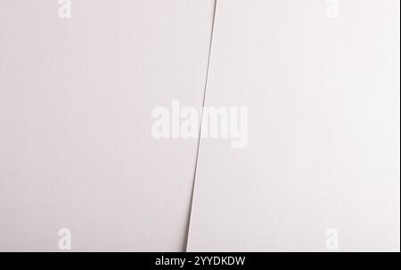 Soft white paper texture with subtle beige and gray tones, featuring a matte, fabric-like surface. The neutral, refined design combines minimalist ele Stock Photo