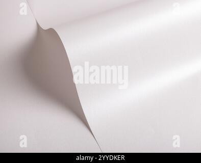 White paper texture with a frosted, metallic finish in soft silver and cool gray tones. The pearlescent sheen, sleek gradient, and shimmering highligh Stock Photo