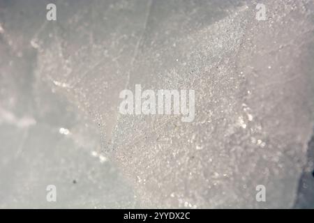 This extreme close-up reveals the stunning details of an iceberg's surface and structure. The image captures the intricate textures and shapes formed Stock Photo