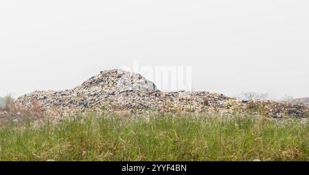 large garbage dump pile  isolated on white background. Stock Photo