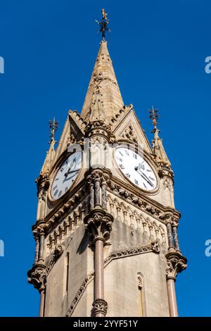 Looking up at sunlit Haymarket Memorial clock tower in Leicester City Centre with clear blue sky behind, England, UK Stock Photo