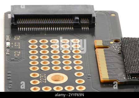 Adapter board for NVME M2 SSD disk for high speed data storage close-up on white isolated background, shows elegant design. Stock Photo