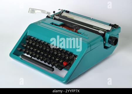 Turin, Piedmont, Italy - 05-15-2024- An old green mechanical typewriter from the Italian company Olivetti Stock Photo