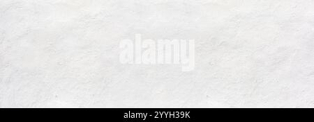 White rustic texture. Retro whitewashed surface of the old wall. Ancient structures. Grungy worn uneven painted plaster. Whiten the facade background Stock Photo