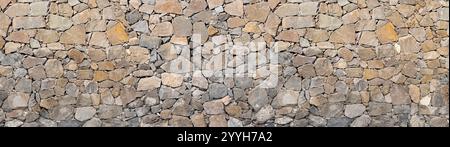 Stone masonry wall texture panoramic backgound Stock Photo