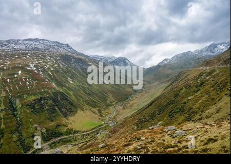 A view of the Swiss Alps and green valley Stock Photo