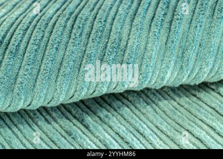 Turquoise textured corduroy fabric patterns closeup as textile background Stock Photo