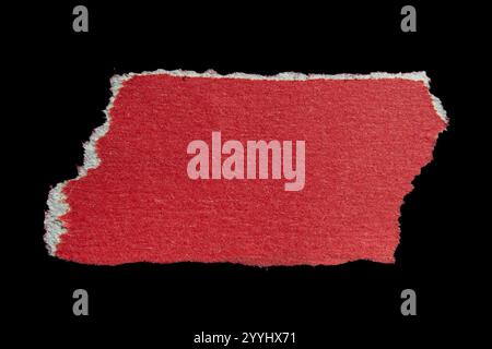 Ripped torn red paper piece isolated on black background Stock Photo