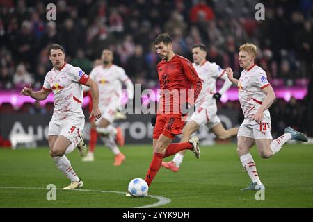 Leon Goretzka FC Bayern Munich FCB (08) Action on the ball Nicolas Seiwald RasenBallsport RB Leipzig RBL (13) Willi Orban RasenBallsport RB Leipzig RB Stock Photo