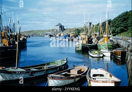 Historical photo of fishing boats in Eyemouth Harbour, Scottish Borders in the 1960s, Scotland, UK Stock Photo